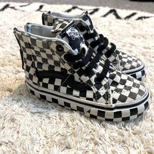 Toddler size 6 black & white checkered vans, high tops with zippers for easy on.